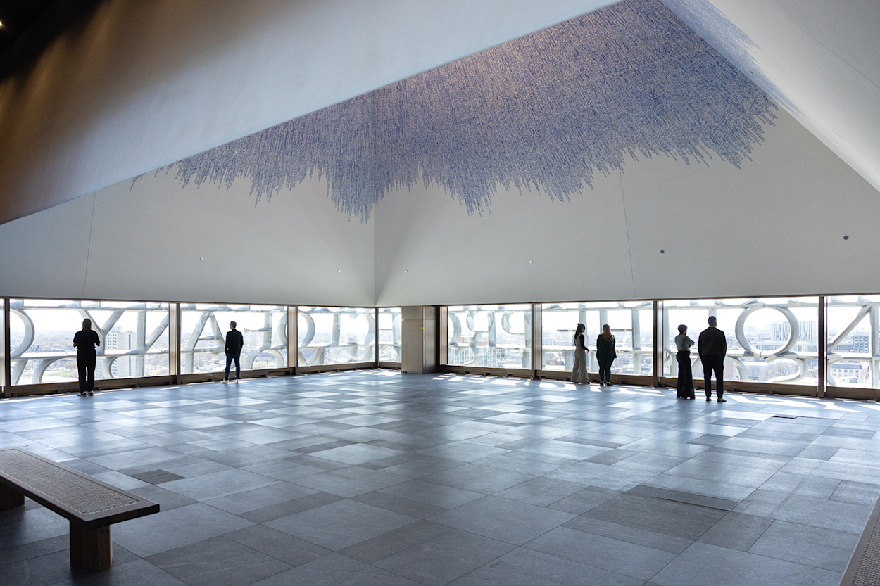 The Nelson Mandela Sky Room at the Obama Presidential Center, with floor-to-ceiling windows overlooking Chicago
